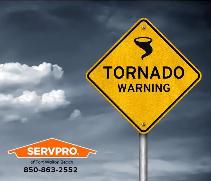 A tornado warning sign is shown.