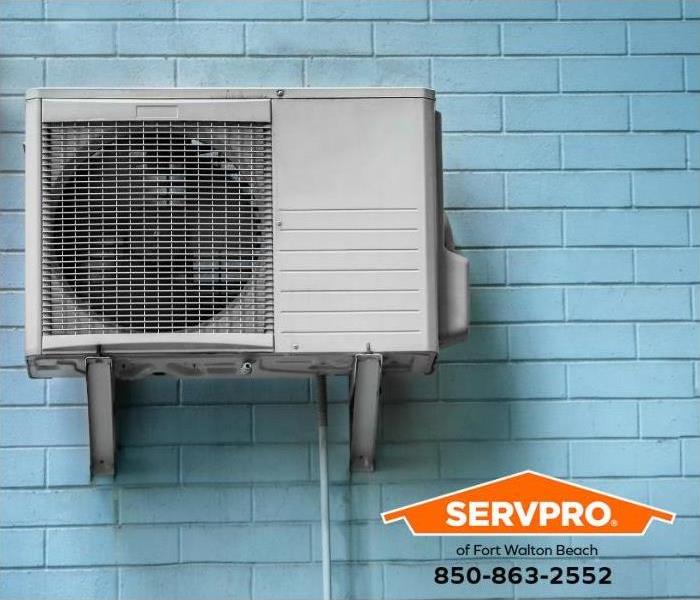 A wall-mounted air conditioning unit is shown.